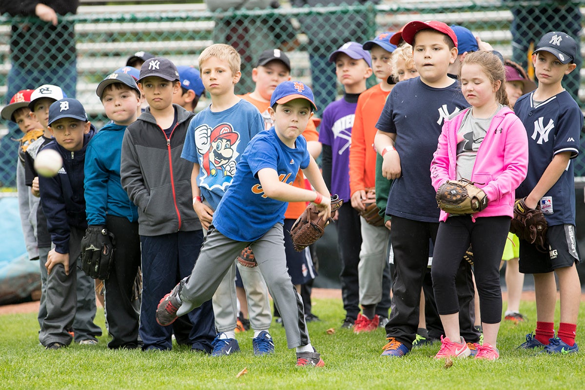 Youth baseball and softball players at clinic